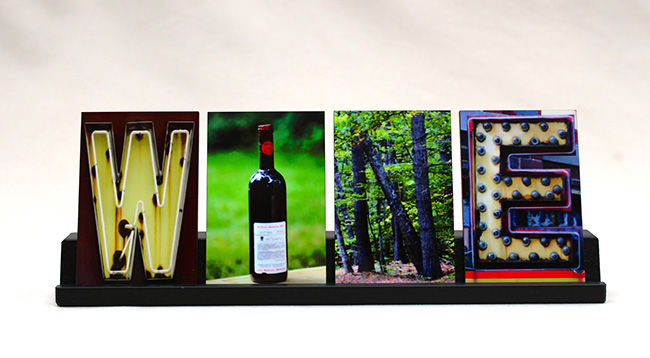 Art gift. Four tiles featuring images of images that make the letters to spell WINE