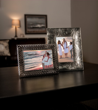 Tabletop with two photo frames shown.