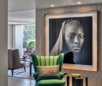 Large custom framed artwork in contemporary room setting.